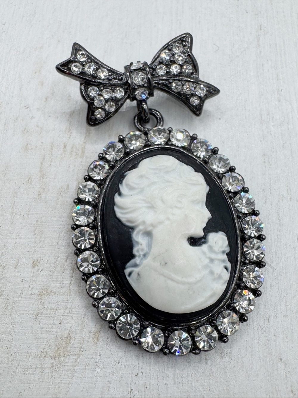 Vintage Victorian revival cameo bow brooch pin black white